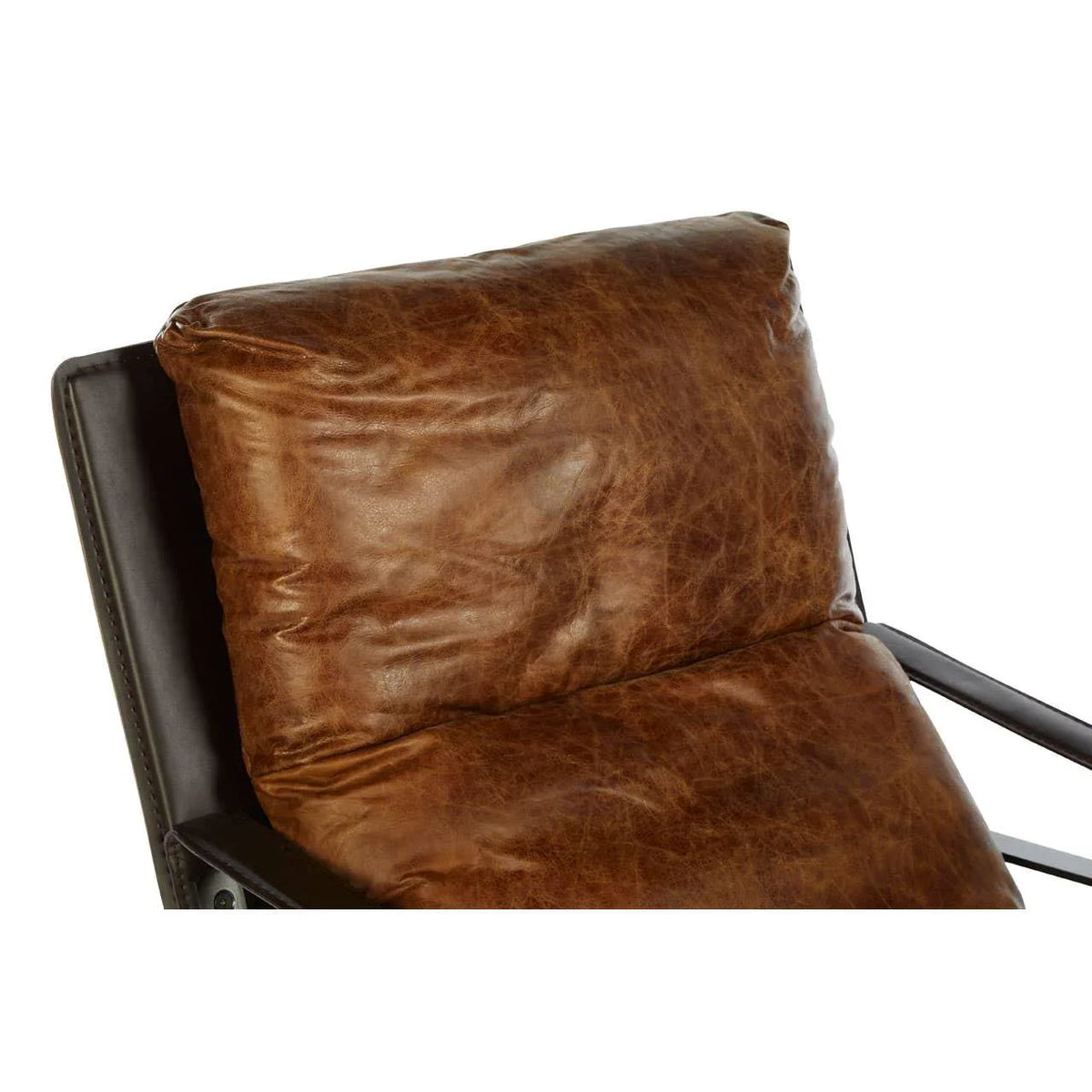 Brown leather armchair with padded backrest and seat, close-up of cushion texture