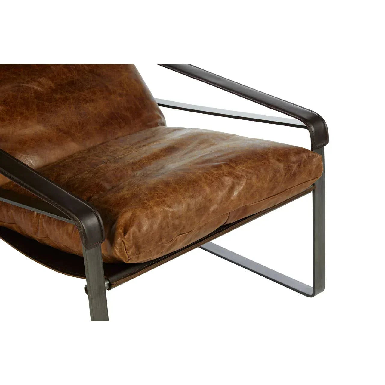 Brown leather armchair seat with black metal frame, close-up view
