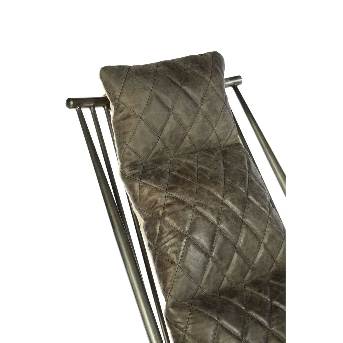 Quilted brown leather chair cushion on metal frame, close up on backrest and pillow