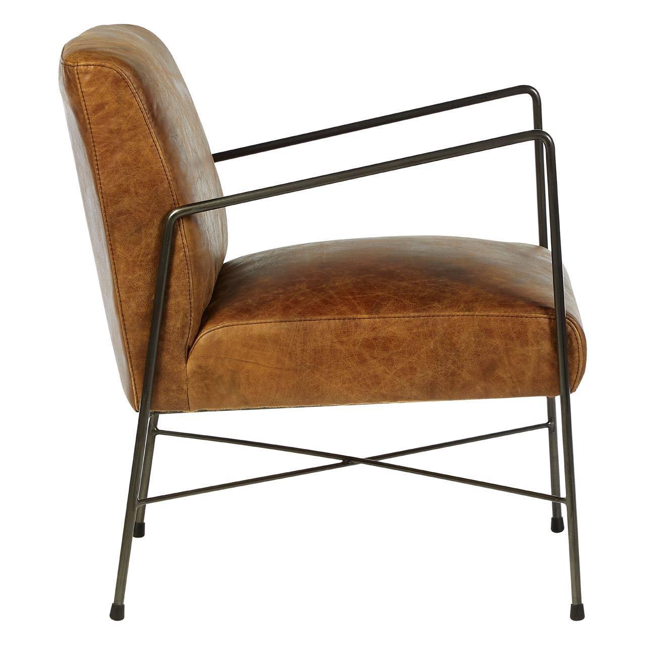 Brown leather armchair with slim black metal frame, side view, modern lounge chair style