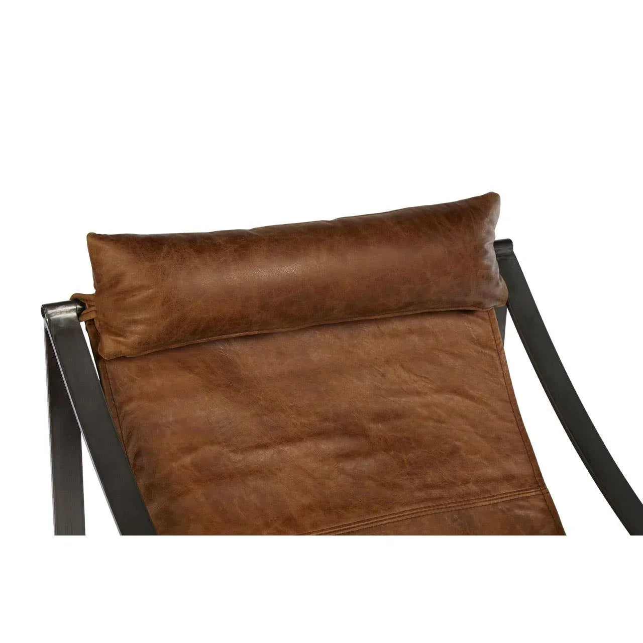 Close-up of brown leather chair headrest with black metal frame