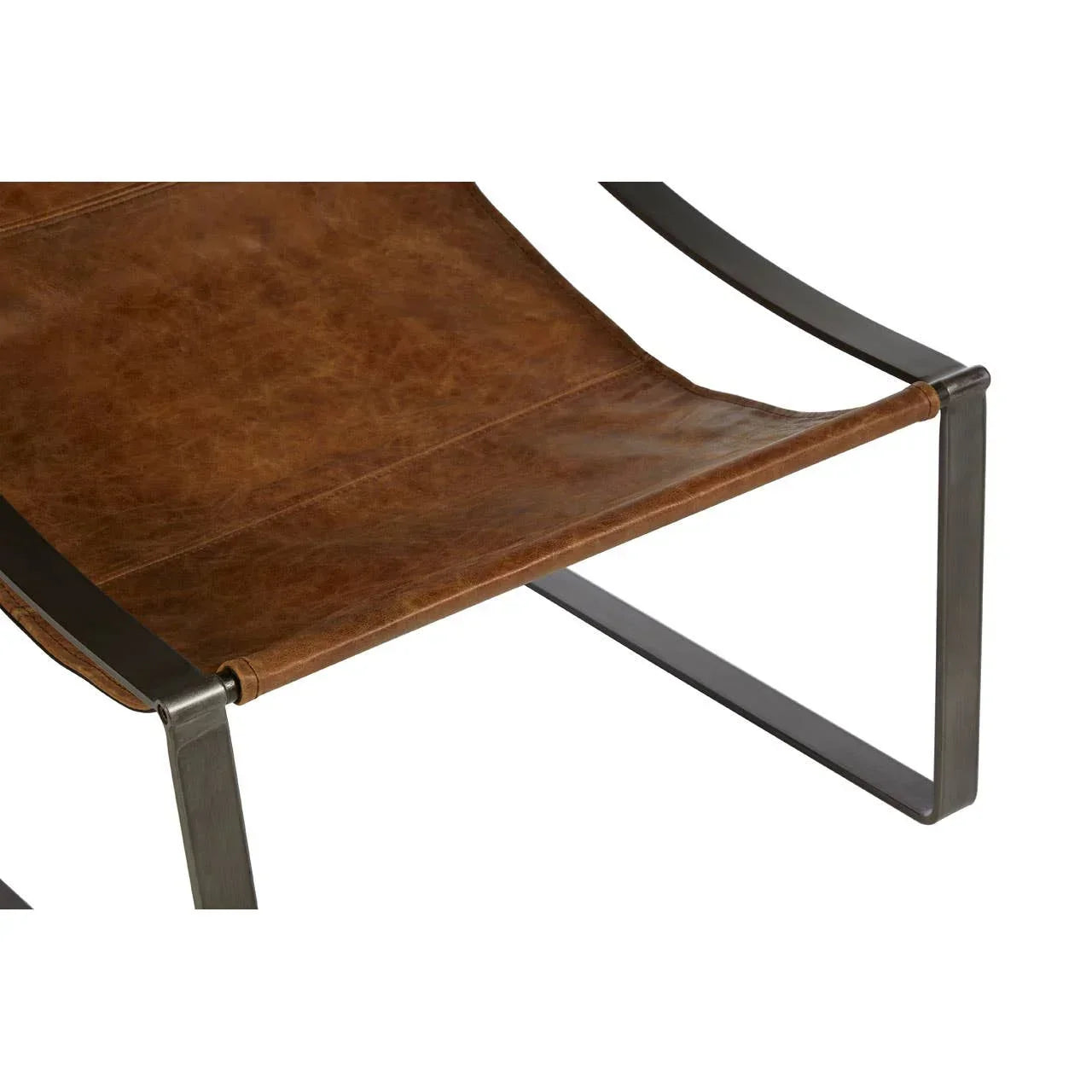 Brown leather sling seat with black metal frame, closeup of accent chair design