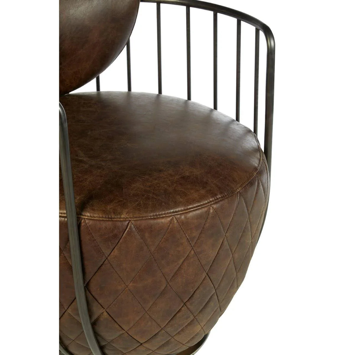Brown leather accent chair with quilted seat and black metal armrests close-up
