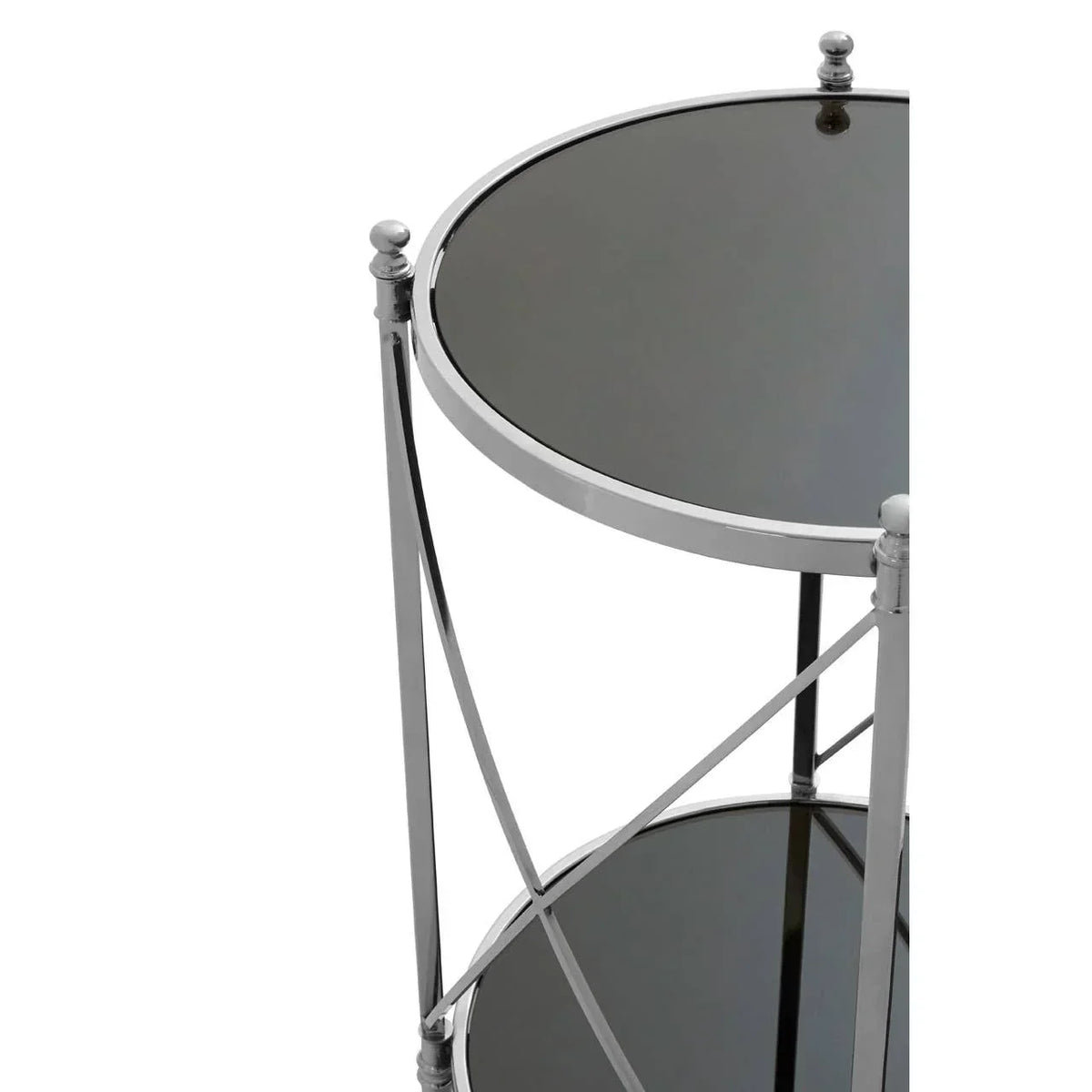 Round chrome side table with black glass shelves, angled view highlighting metal frame detail