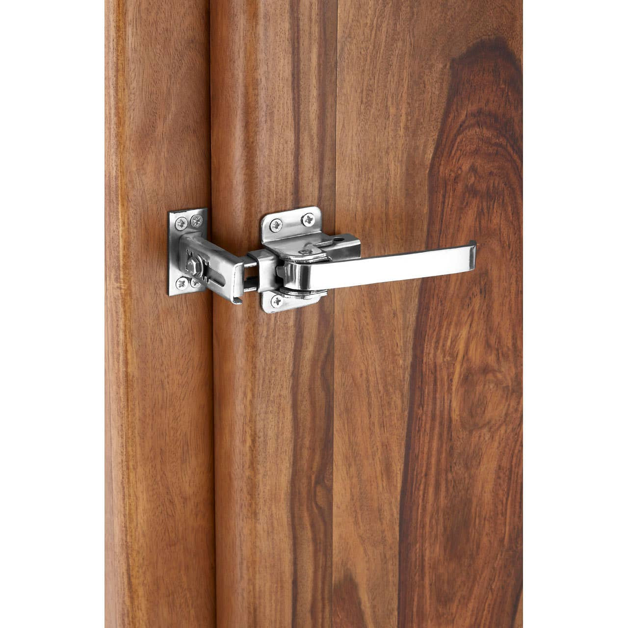 Close-up view of a chrome latch on a tall cabinet made from tropical rose wood, showcasing the rich wood grain and warm tones of the cabinet's surface
