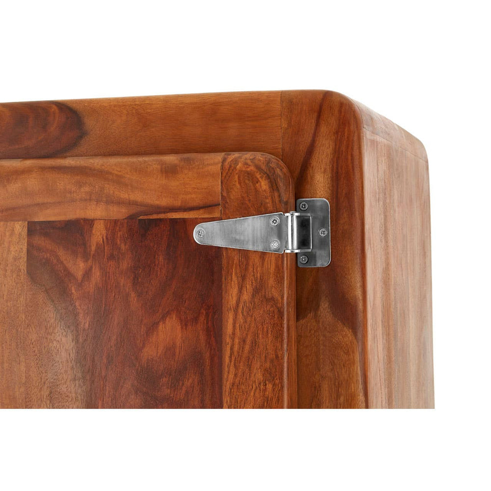 Close-up view of the corner of a Marwar Tall Tropical Rose Wood Cabinet, showcasing the smooth, rich wood grain and a metal hinge attached to the cabinet door. The warm tones of the rose wood highlight its natural beauty and craftsmanship