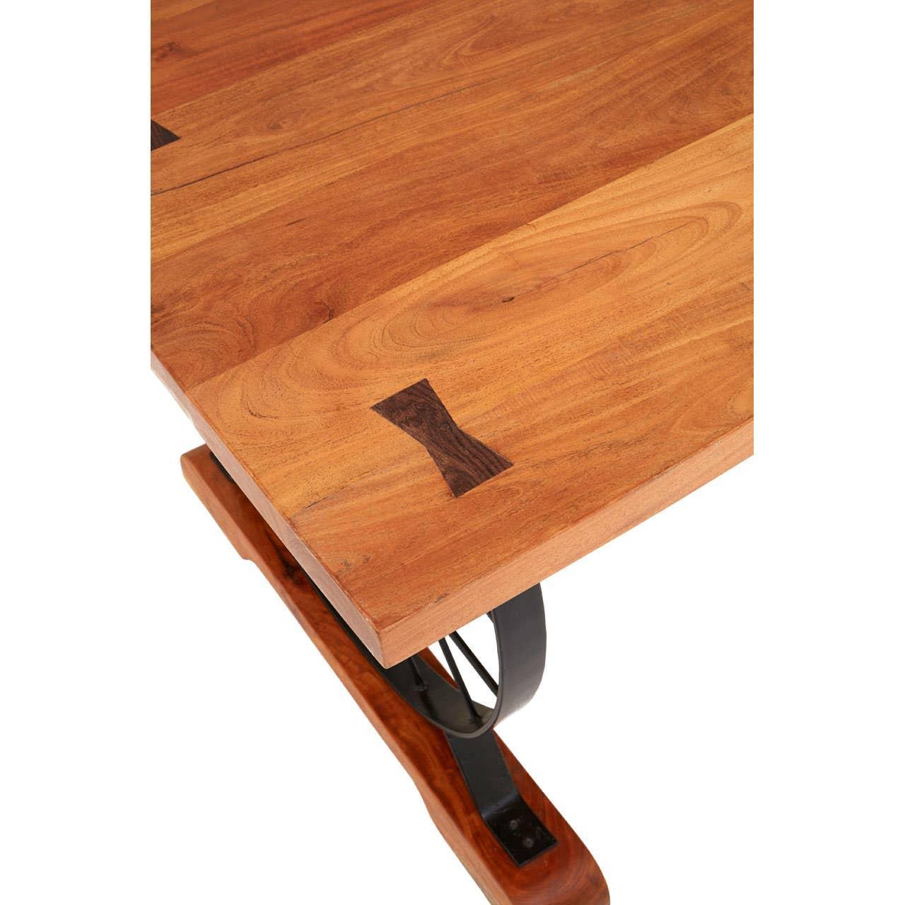 Solid wood dining table with visible butterfly joint detail and metal leg support