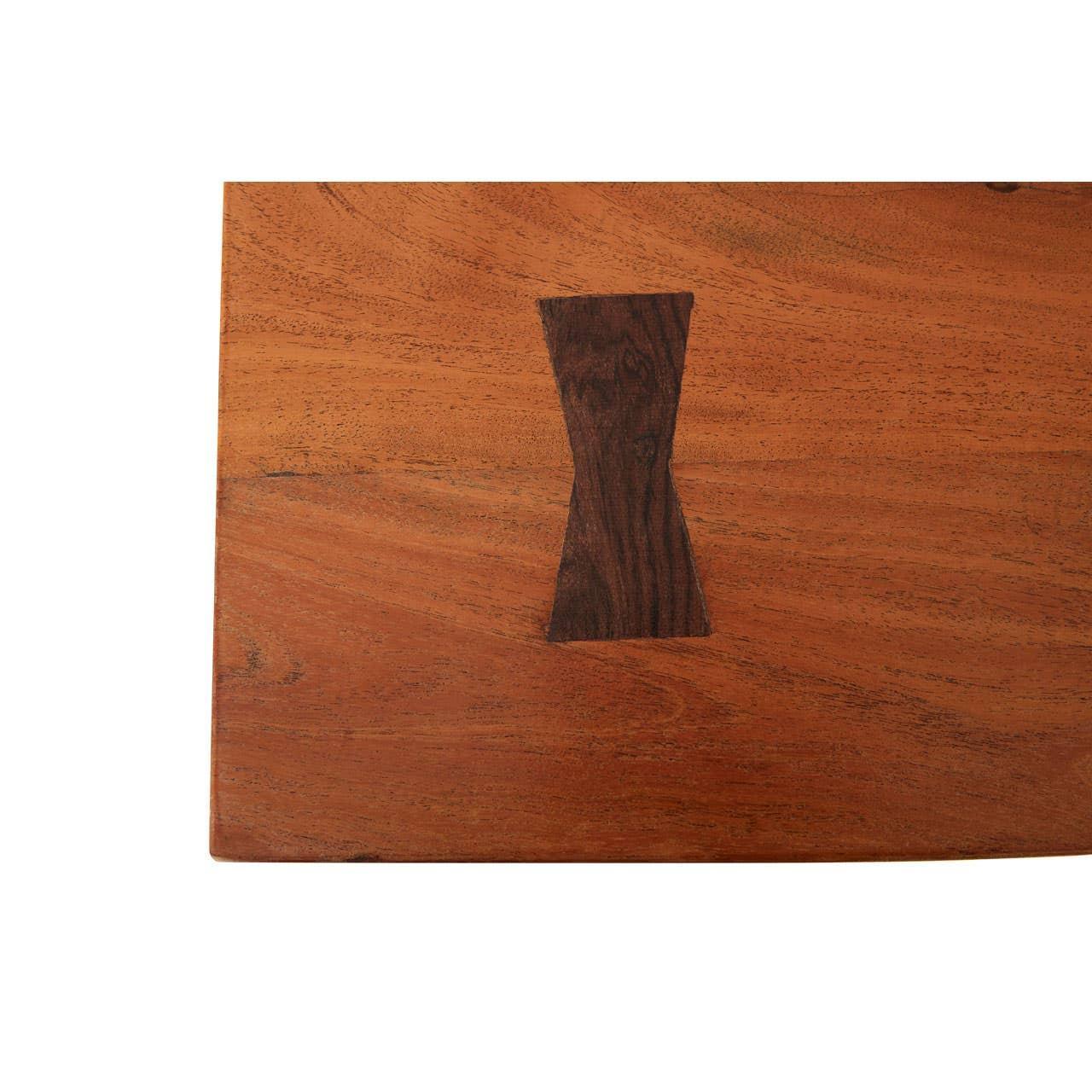 Closeup of wooden dining table top with dark butterfly joint accent