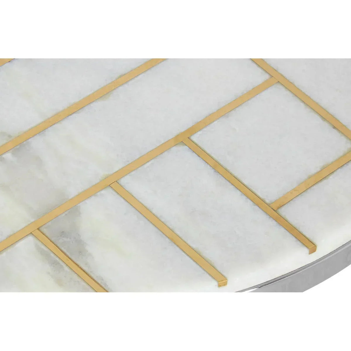 Marble table top with gold metal inlay detail, geometric pattern close-up