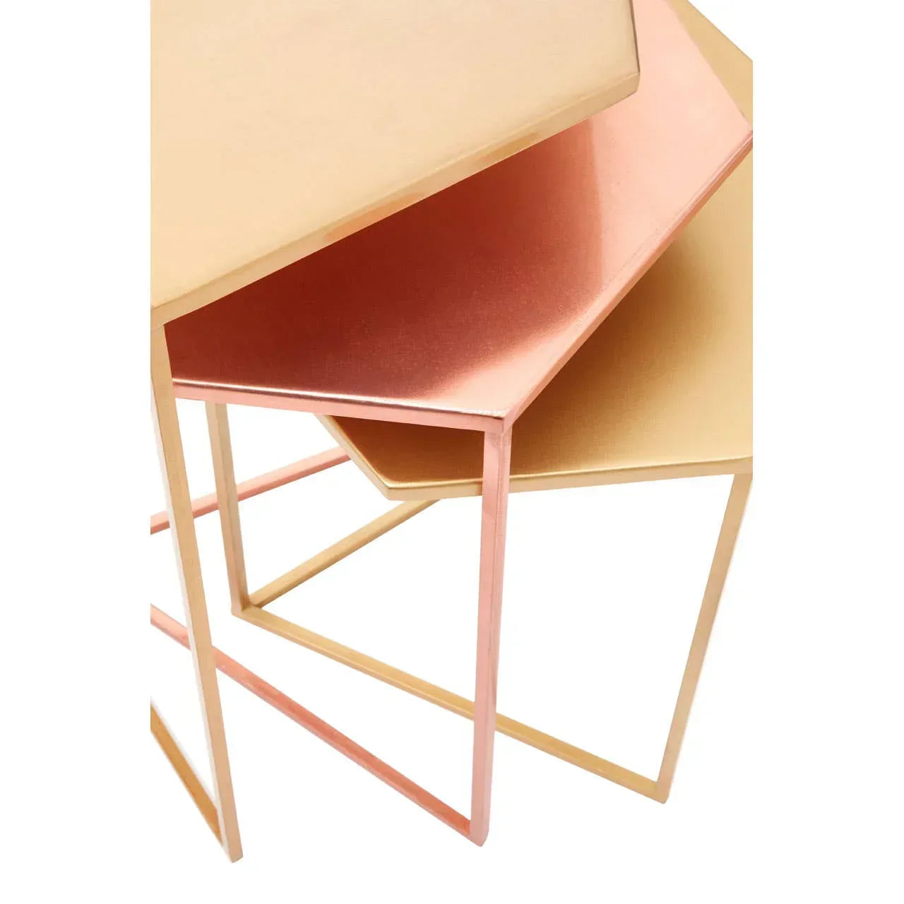 Set of modern nest tables with metallic gold and copper hexagonal tops, angled close-up view
