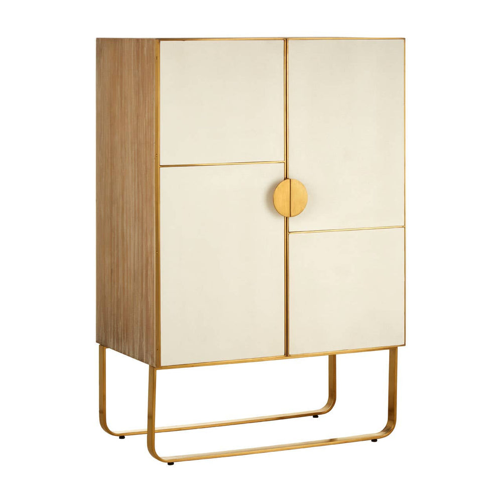 A stylish cabinet featuring a combination of oak wood and brushed gold accents. The cabinet has two doors with a smooth, light-colored finish and a round gold handle, standing on a sleek gold metal base. The overall design is modern and elegant, suitable for home decor