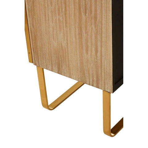 Close-up view of the Modica cabinet featuring a light oak wood finish with a brushed gold metal base. The cabinet has a sleek design with clean lines and a modern aesthetic, showcasing the contrast between the natural wood and the metallic legs