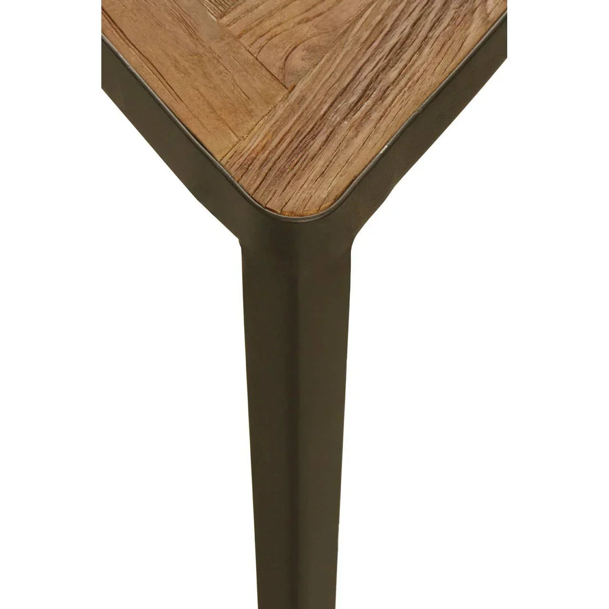 Dining table corner with light wood top and metal leg, close-up of joinery