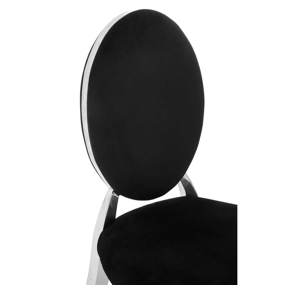 Black velvet dining chair with oval back and chrome frame close-up