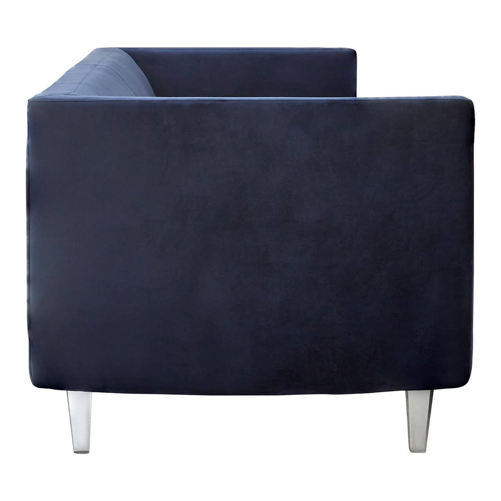 Navy velvet three-seater sofa with a sleek, modern design, featuring a low back and clean lines. The sofa is supported by slender metallic legs, adding a contemporary touch. The upholstery appears soft and plush, showcasing a rich navy color