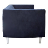Navy velvet three-seater sofa with a sleek, modern design, featuring a low back and clean lines. The sofa is supported by slender metallic legs, adding a contemporary touch. The upholstery appears soft and plush, showcasing a rich navy color