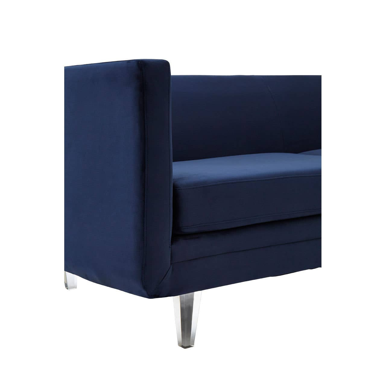 Navy velvet three-seater sofa featuring a modern design with clean lines, a low backrest, and sleek metal legs. The fabric has a soft texture, and the sofa is shown from a corner angle, highlighting its contemporary style and sturdy construction
