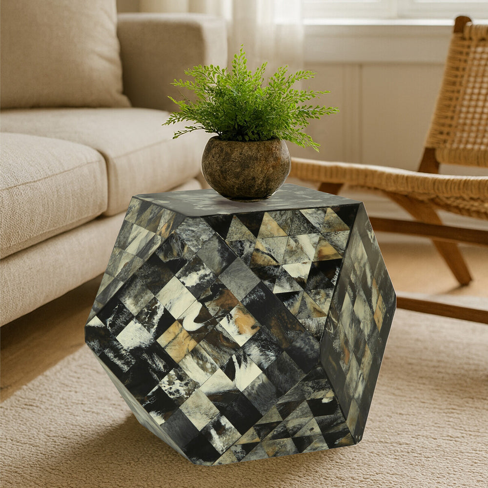 Antique green mosaic geometric hexagon side table featuring a multi-colored mosaic pattern with gold and silver accents, topped with a small potted plant. The table is positioned next to a light-colored sofa and a wooden rocking chair, set on a beige carpet. Natural light filters through a nearby window, illuminating the scene