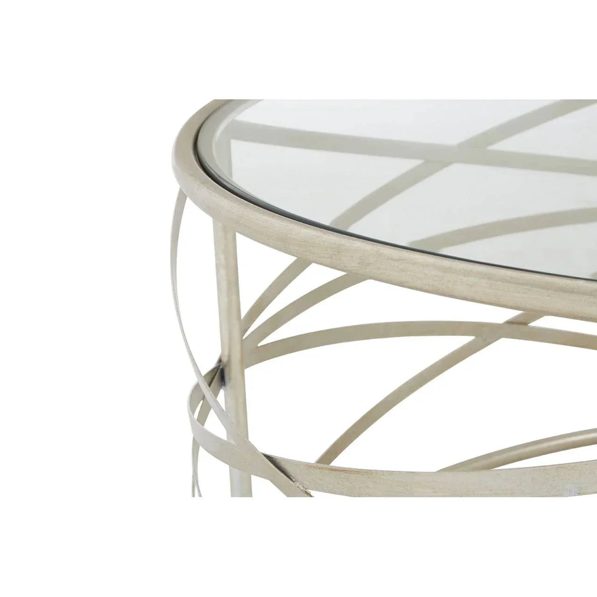 Round glass coffee table with silver metal frame and curved geometric legs, closeup view