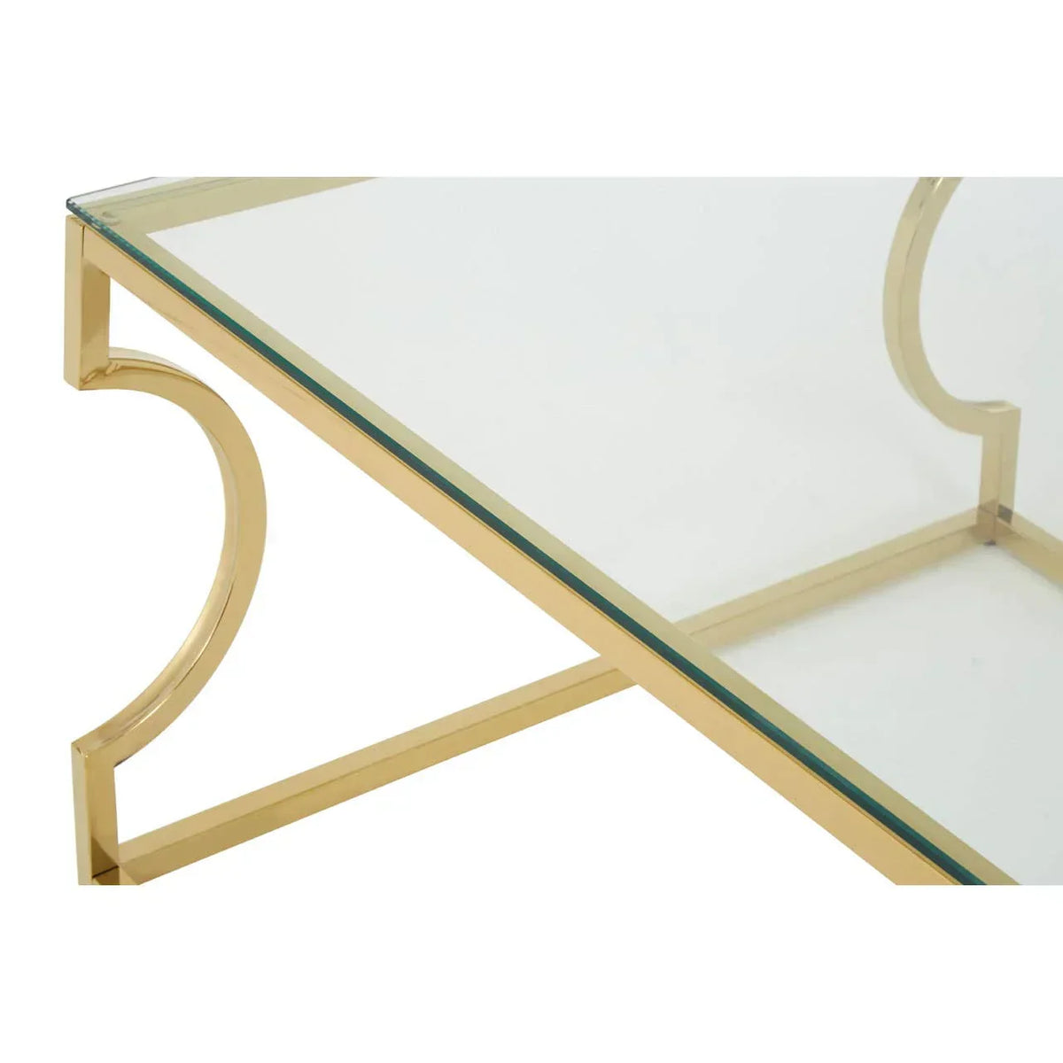 Glass coffee table with gold metal frame and curved side detail, close-up view