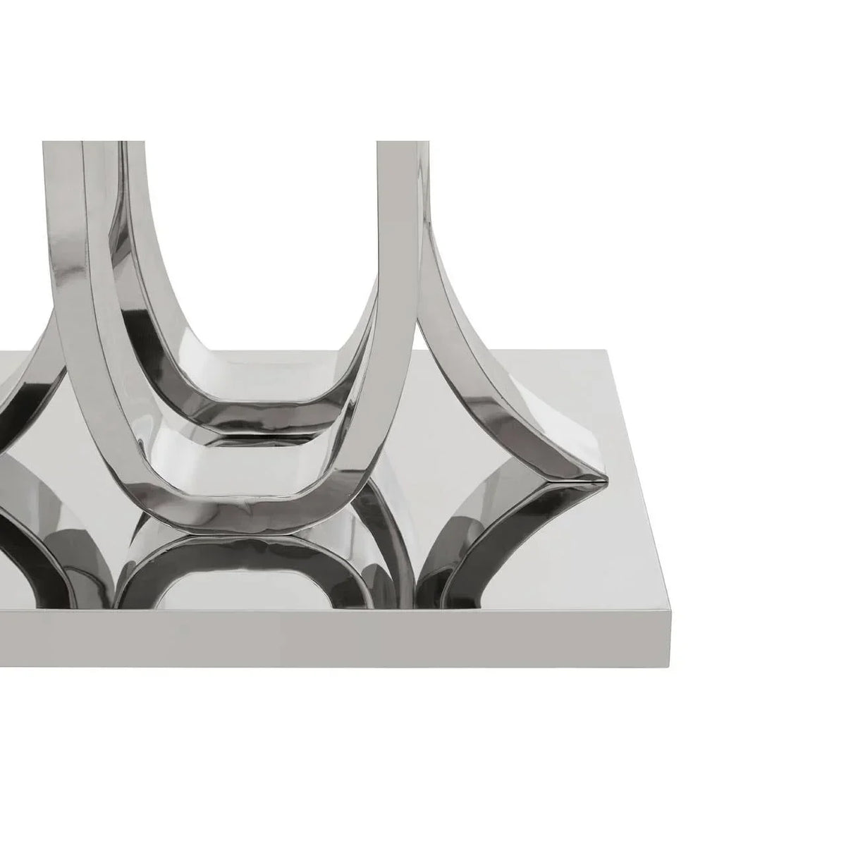 Chrome metal dining table base with U-shaped legs on reflective rectangular platform