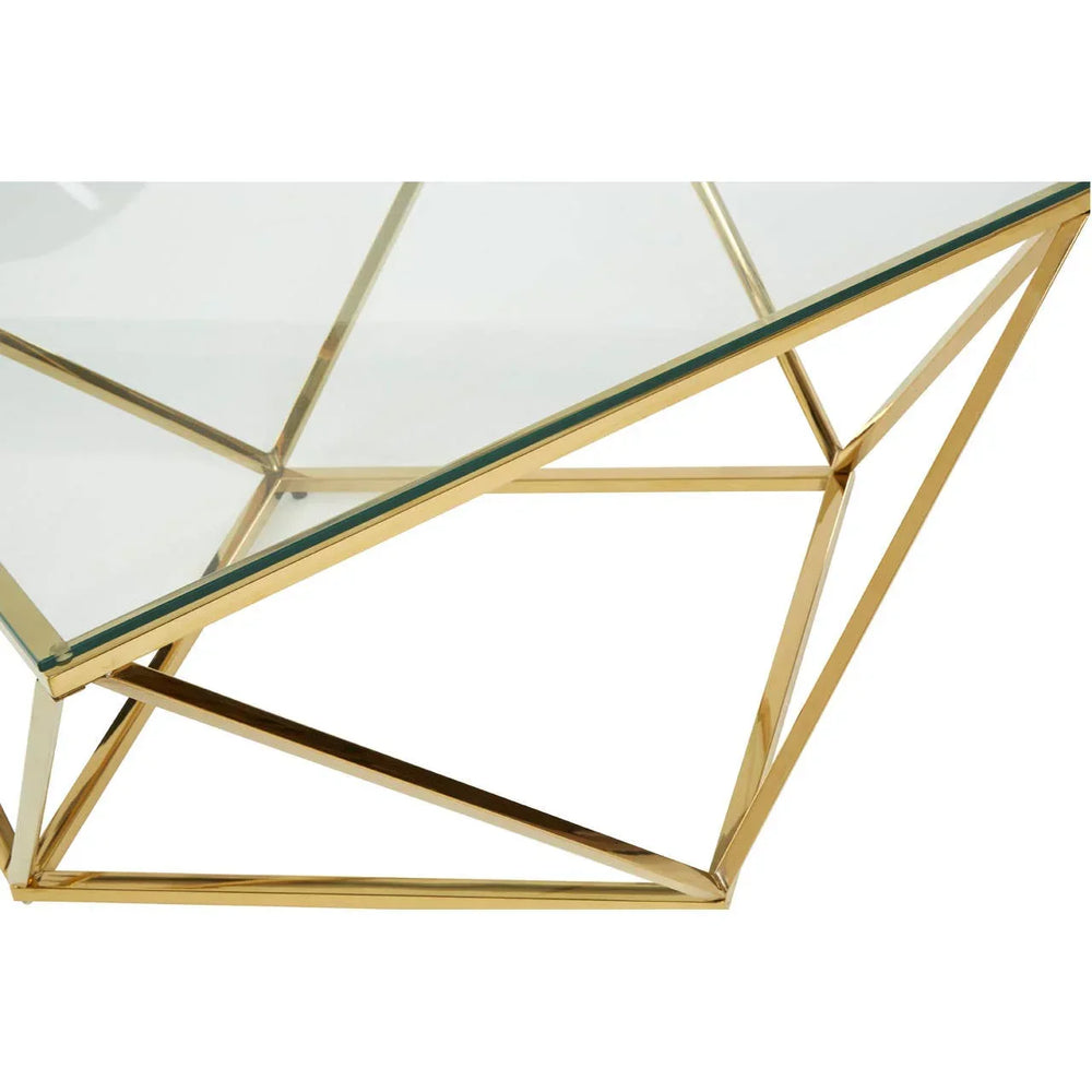 Glass coffee table with gold geometric metal frame, angled close-up view