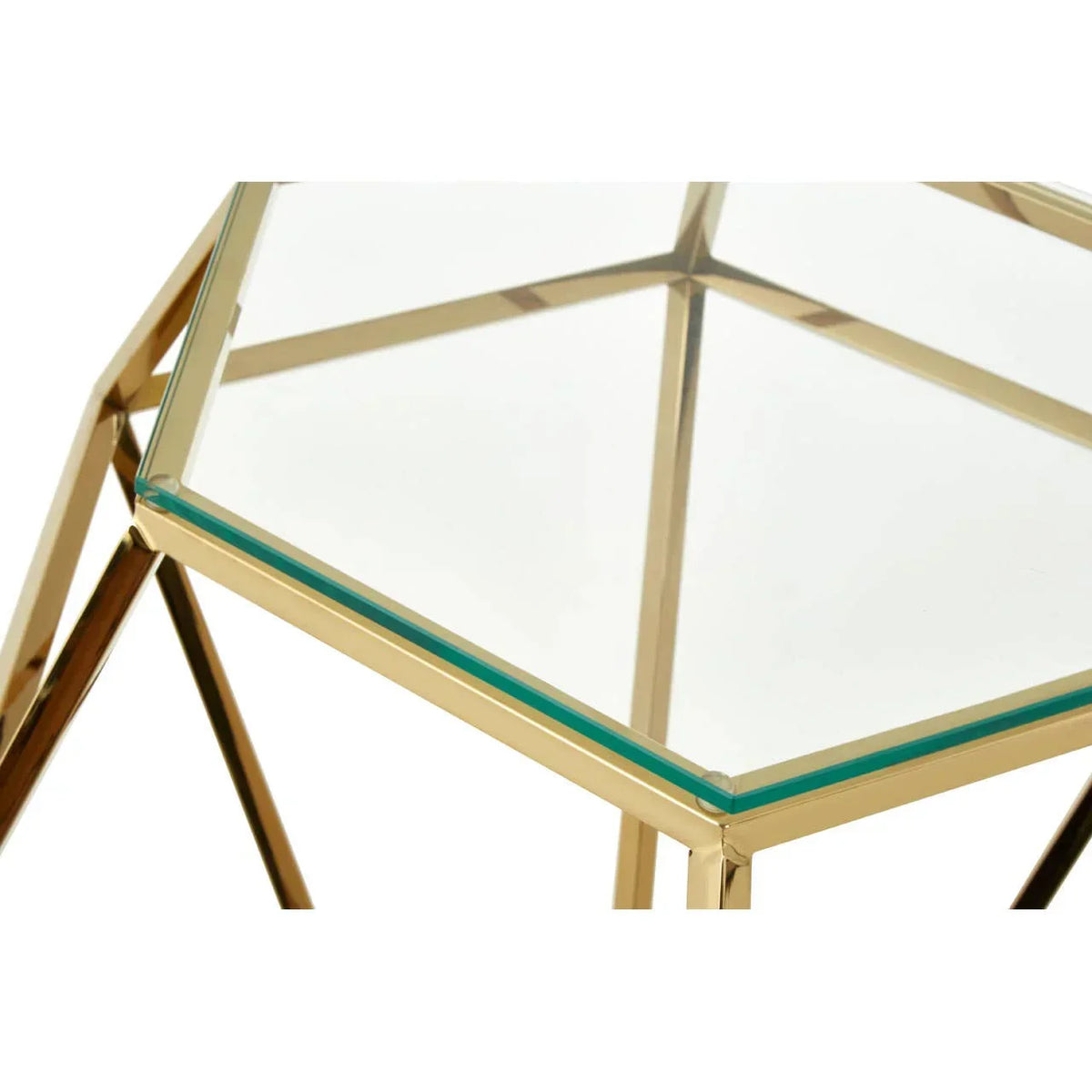 Glass top side table with gold metal geometric frame, corner detail view