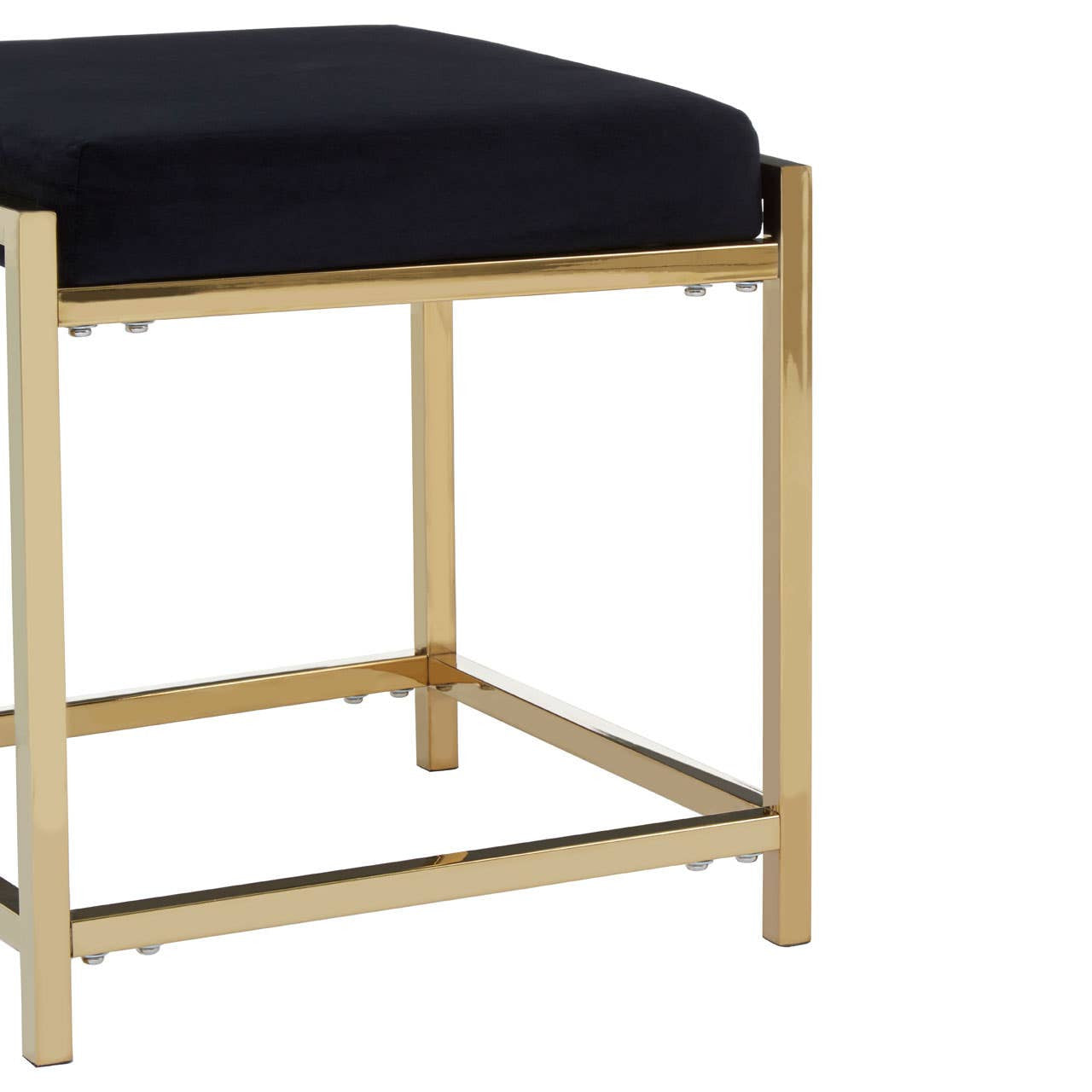 Black velvet stool with a gold finish metal frame, featuring a cushioned top and a sturdy base with crossbars for added support. The design is sleek and modern, suitable for various home decor styles