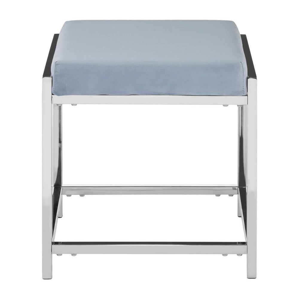 A powder blue velvet stool with a cushioned top and a sleek silver metal frame, featuring a minimalist design with clean lines and a sturdy base. The stool has a square shape and is positioned with its top facing upward, showcasing the soft texture of the velvet fabric