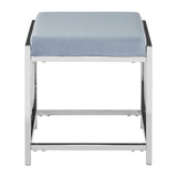 A powder blue velvet stool with a cushioned top and a sleek silver metal frame, featuring a minimalist design with clean lines and a sturdy base. The stool has a square shape and is positioned with its top facing upward, showcasing the soft texture of the velvet fabric