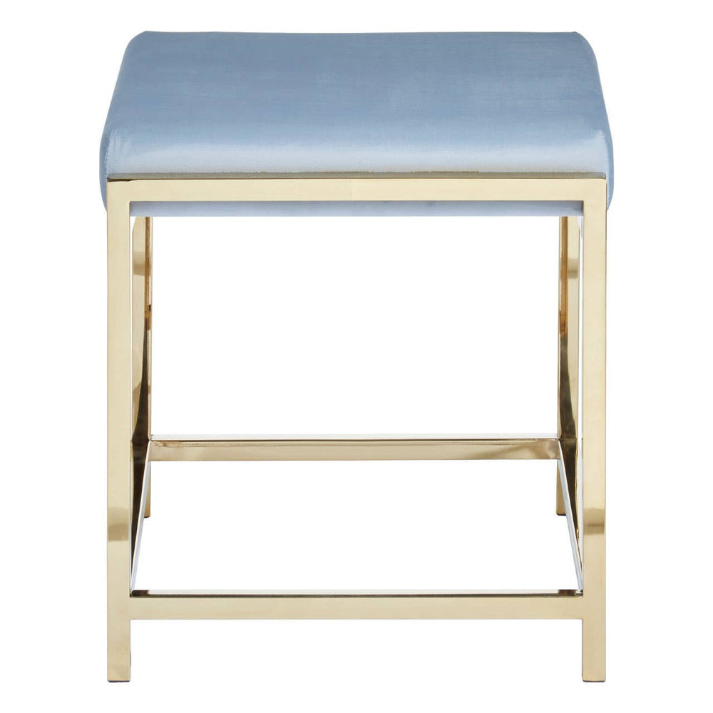 A powder blue velvet stool with a rectangular seat and a sleek gold metal frame, featuring a crossbar for added stability. The design is modern and elegant, suitable for various home decor styles