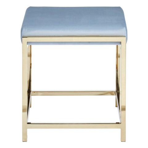A powder blue velvet stool with a rectangular seat and a sleek gold metal frame, featuring a crossbar for added stability. The design is modern and elegant, suitable for various home decor styles