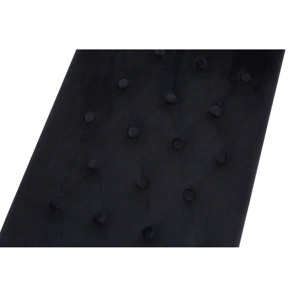 Black velvet headboard with button tufted detail in close-up view