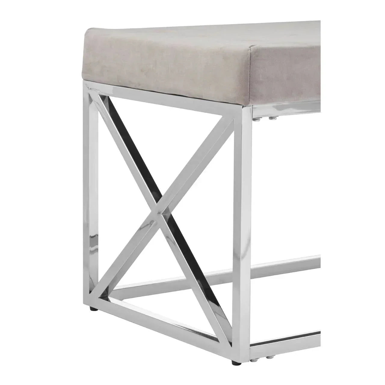 Grey velvet bench seat with chrome metal X-frame base, corner angle view