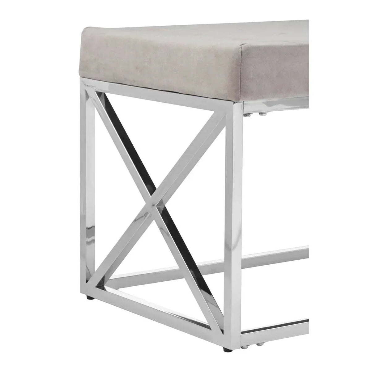 Grey velvet bench seat with chrome metal X-frame base, corner angle view