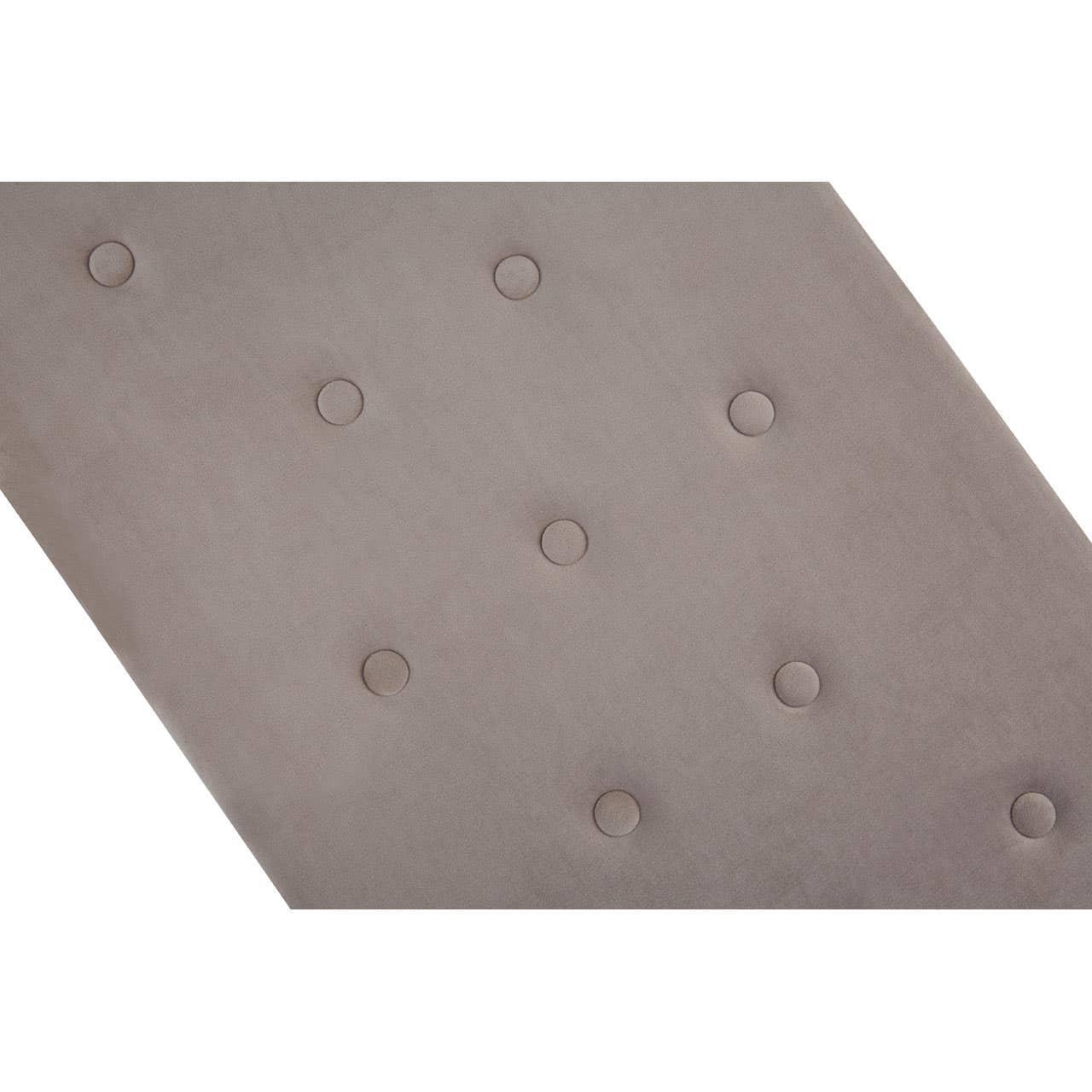 Closeup of taupe fabric headboard with button tufted upholstery
