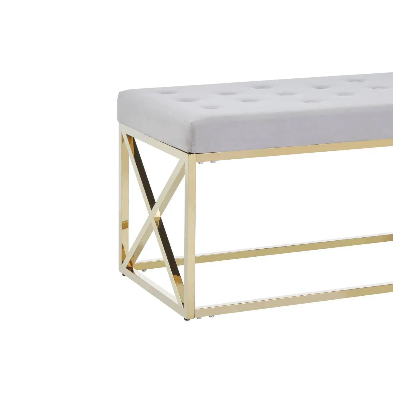 Grey upholstered bench with tufted seat and gold metal frame, corner angle view