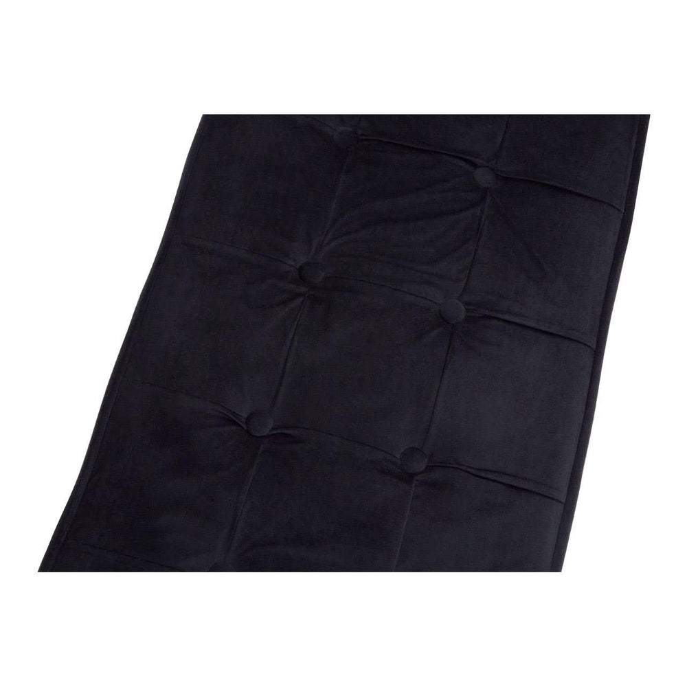 Black velvet tufted sofa seat close-up showing button detail