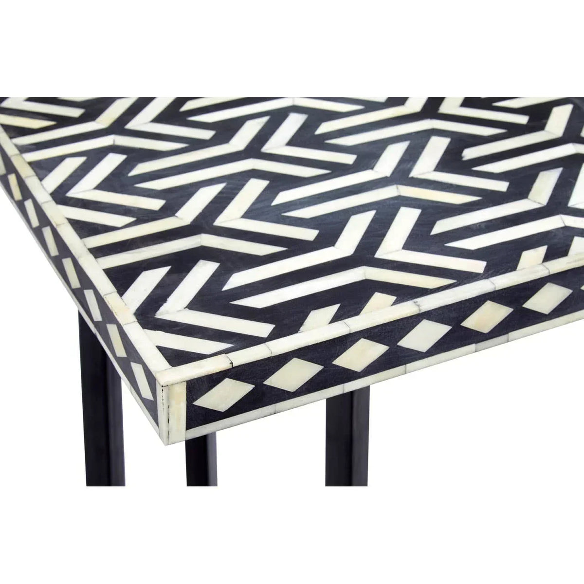 Black and white patterned side table with bone inlay detail on geometric top