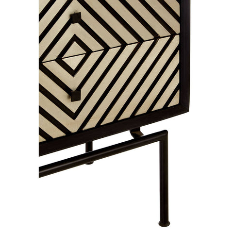 Boho mango wood chest featuring a patterned front with geometric designs in a natural and black color scheme, supported by slender metal legs. The chest includes five drawers for storage