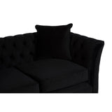 A sleek black two-seat sofa featuring a tufted design and a matching square cushion, showcasing a modern and elegant aesthetic suitable for various living spaces