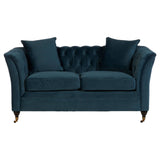 Midnight blue velvet two-seat sofa with a tufted backrest, featuring two matching cushions and elegantly curved arms, supported by wooden legs with a gold finish