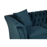 Midnight blue velvet two-seat sofa featuring a tufted backrest and a plush seat cushion, accompanied by a matching decorative pillow on one side. The sofa has curved armrests and a sleek, modern design