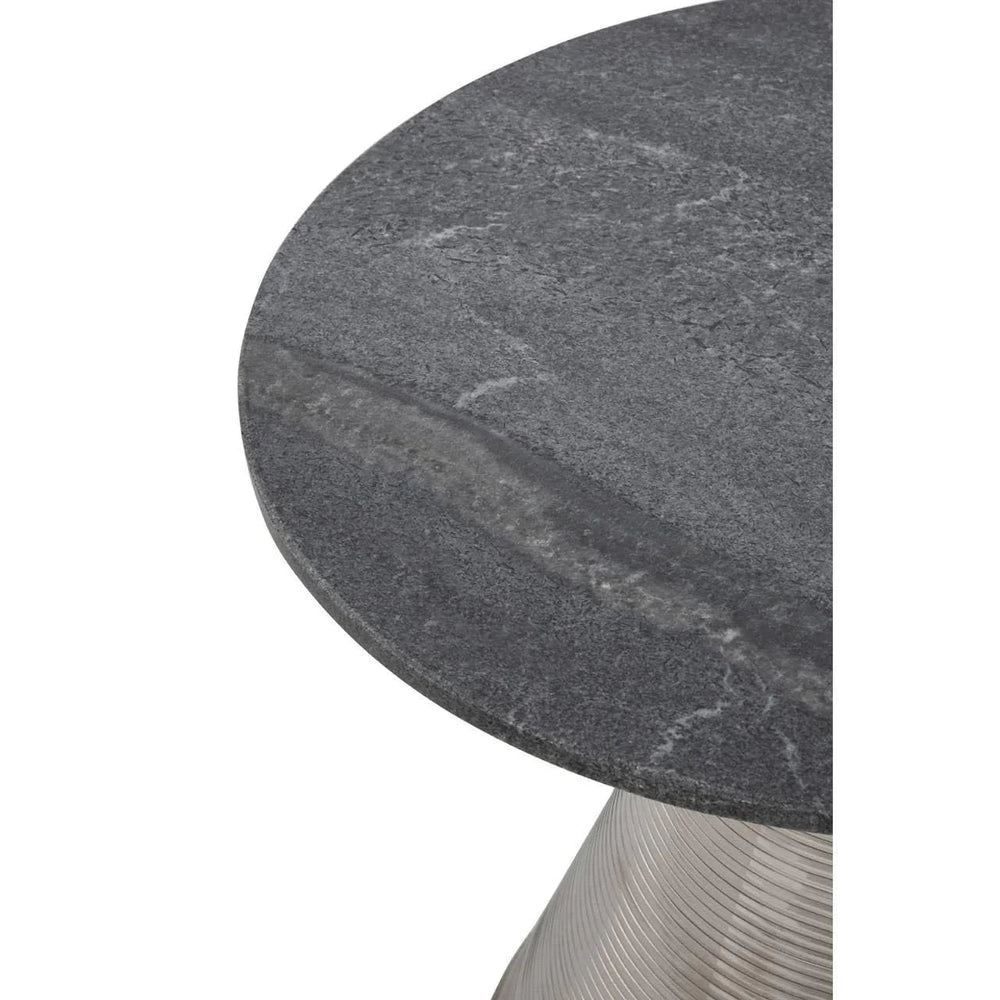 Round grey stone coffee table top with brushed metal base close-up