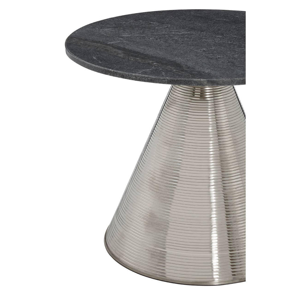 Round side table with black stone top and ribbed metallic cone base, close-up view