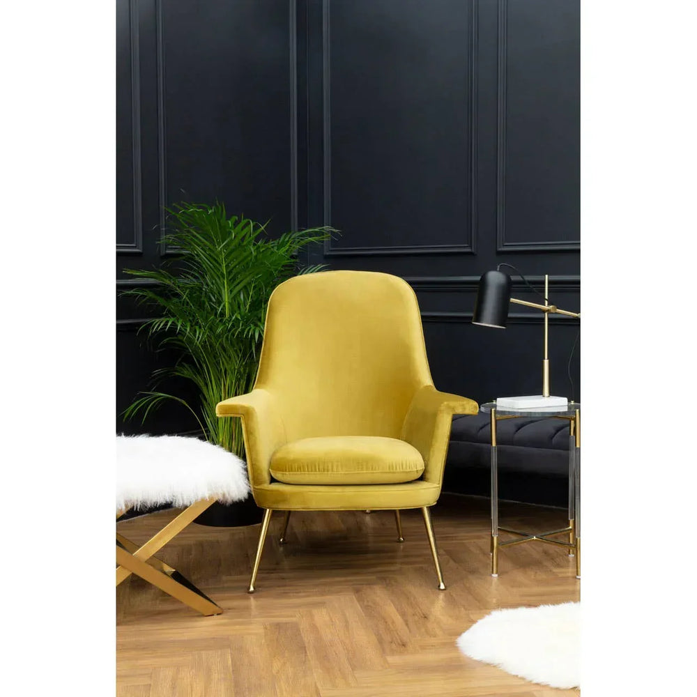 Yellow velvet accent chair with gold legs in modern living room setting