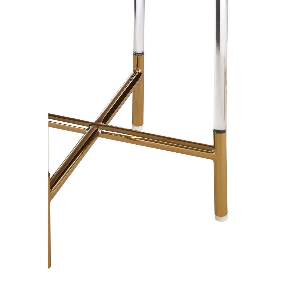 Gold metal cross-leg detail on modern table base with chrome accents