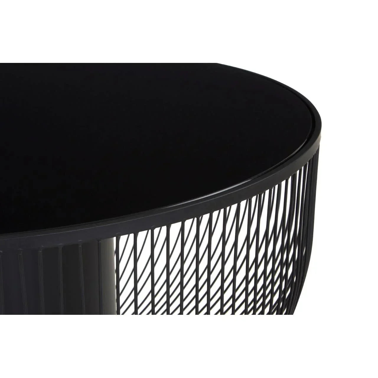 Round black metal coffee table with wire frame detail, close-up of tabletop and base
