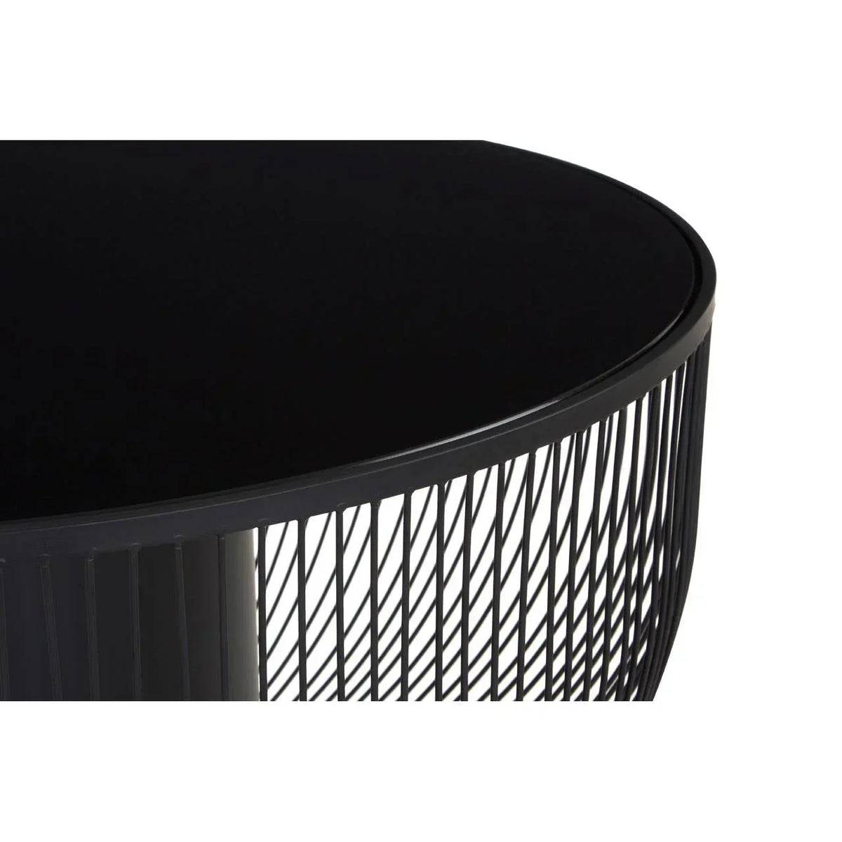 Round black metal coffee table with wire frame detail, close-up of tabletop and base