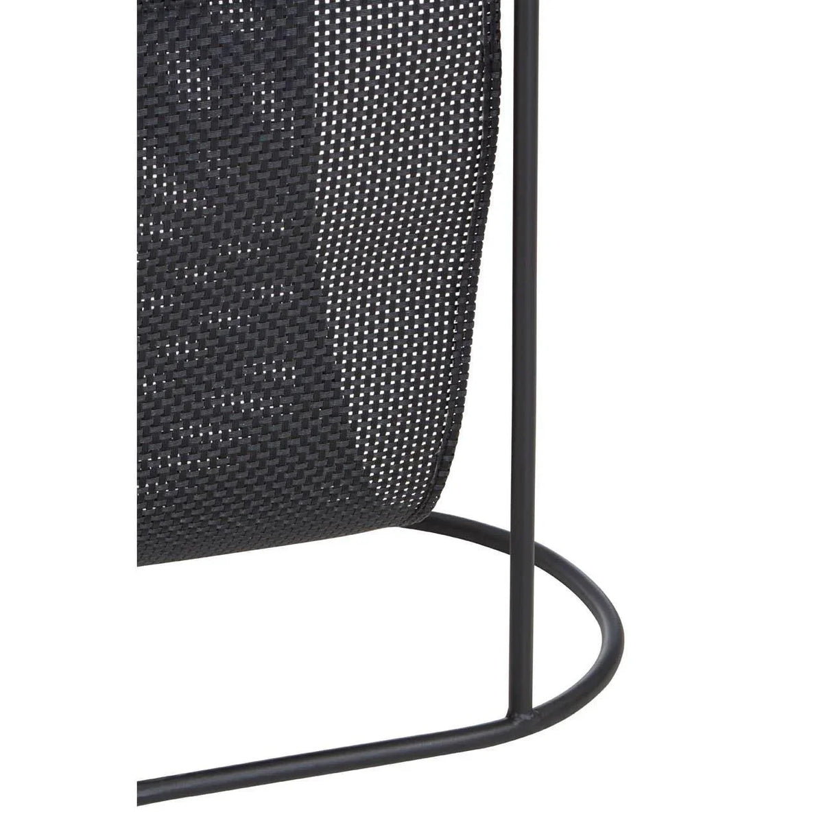 Black metal magazine rack with woven detail and curved base